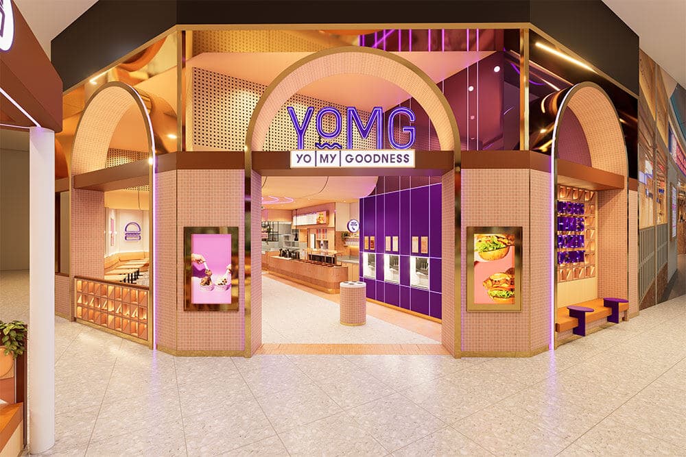 Freshly painted YOMG storefront with arched entry and pastel pink and purple finishes